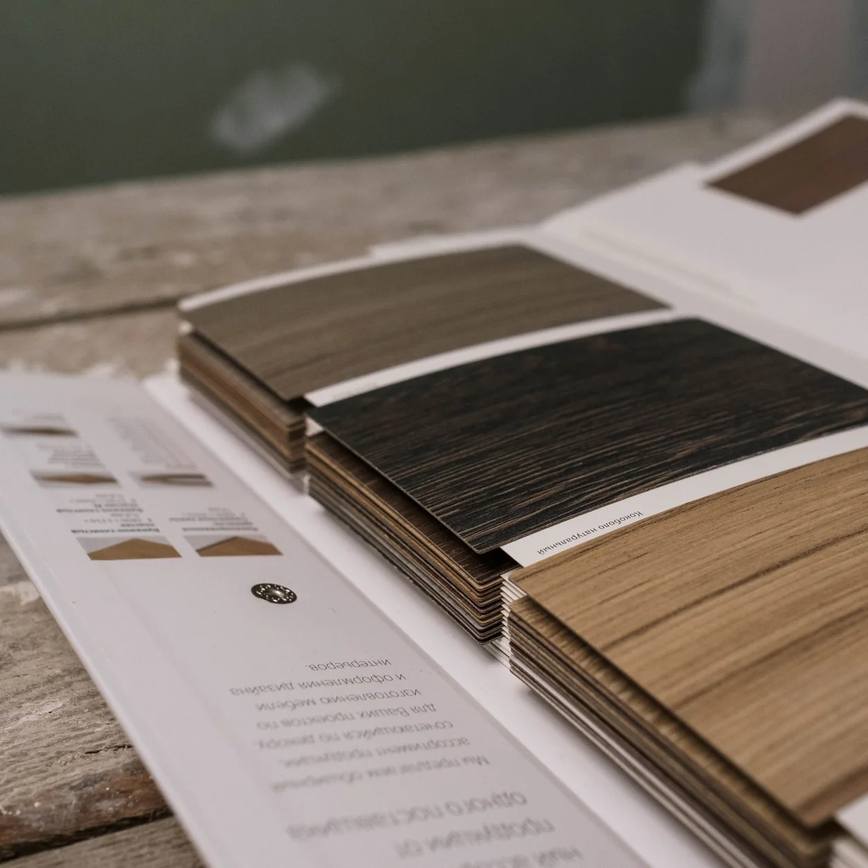 A selection of wooden flooring samples on a worktable.