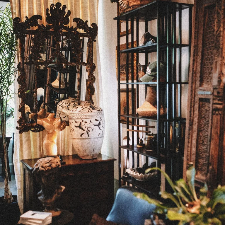 Warm, vintage-style artisan decor featuring curated home goods in a cozy boutique setting.